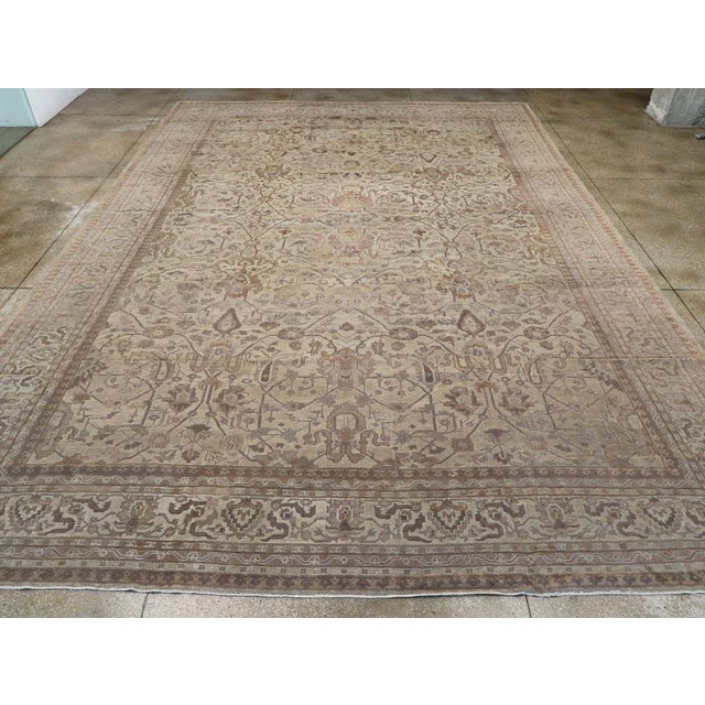 An antique Turkish Oushak oversize carpet handmade during the Early 20th century. Measures: 13' 7" x 19' 4"
