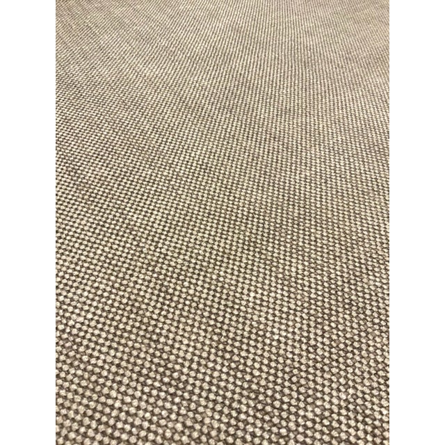 This neutral and versatile have is woven and has a gray beige and white colorway. Its hand is course, and it is...