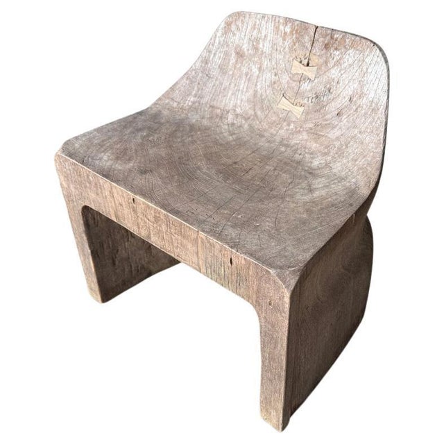 A century old teak block is hand carved into this beautiful low chair or side table. We added the inlaid butterfly detail...