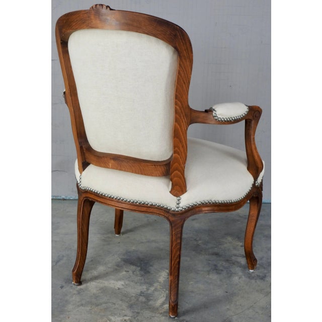This chair is a beautiful warm walnut in the traditional Rococo style. Covered in a gorgeous Belgian linen this chair will...