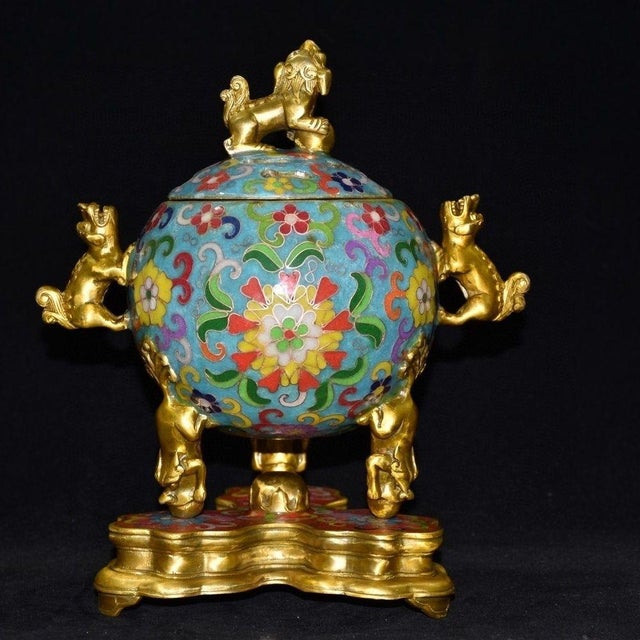 This is an ornate vintage Chinese cloisonné enamel censer, designed for burning incense. The piece features a spherical,...