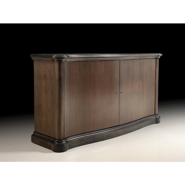Handcrafted in Italy from solid European beech wood, this credenza features a graceful serpentine front and a light...