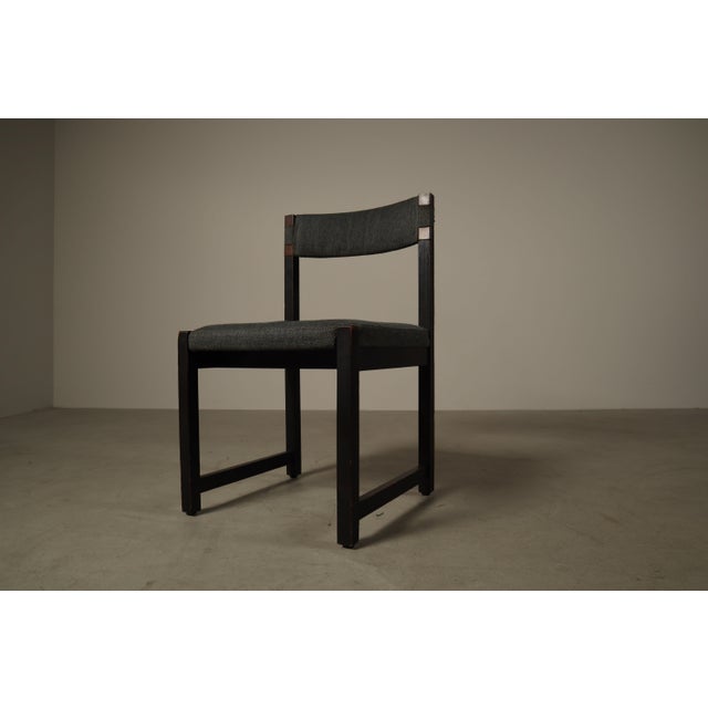 These chairs are characteristic of Jean Batenburg’s architectural design language, combining a strict geometric wooden...