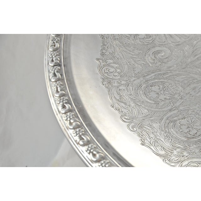 Vintage oversize 18" round silver-plate tray meant to be an elegant server for sliced meats, cheeses, breads, cookies,...