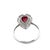 18K gold ring featuring a 0.88-carat pear-cut red ruby, surrounded by 0.29 carats of round-cut white diamonds. The design...