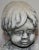 The child starring in this concrete statue will melt your heart. He is affectionately petting two little bunnies in his...