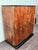 This refined Art Deco-style double-door wardrobe is crafted from walnut burl and dates back to the 1930s or 1940s in...