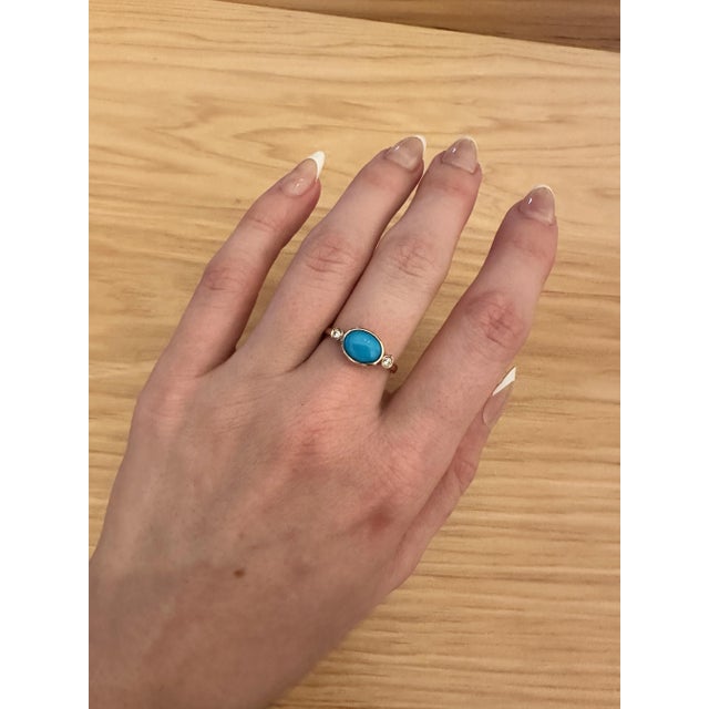 This beautiful ring features a bezel set east west turquoise gemstone of 1.58 carat with natural earth mined diamonds, all...
