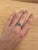 This beautiful ring features a bezel set east west turquoise gemstone of 1.58 carat with natural earth mined diamonds, all...