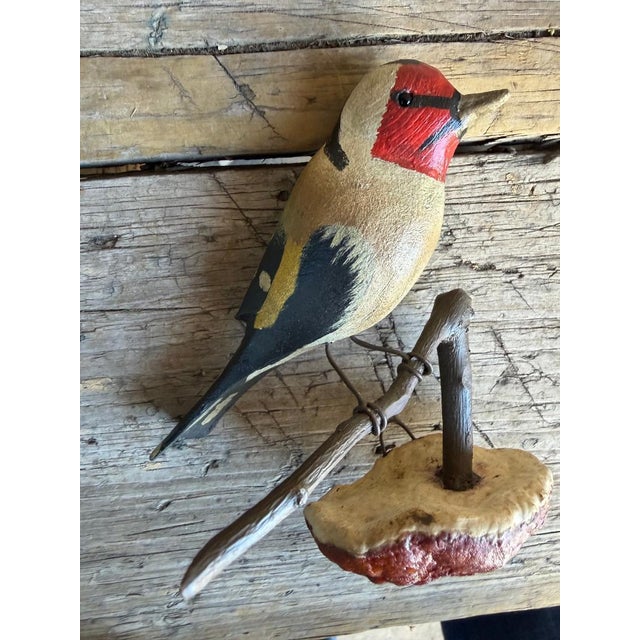 A folk art bird from Austria — hand carved wood. Measures 5.5" x 4.75" x 2". A charming folk-art carving for a shelf,...