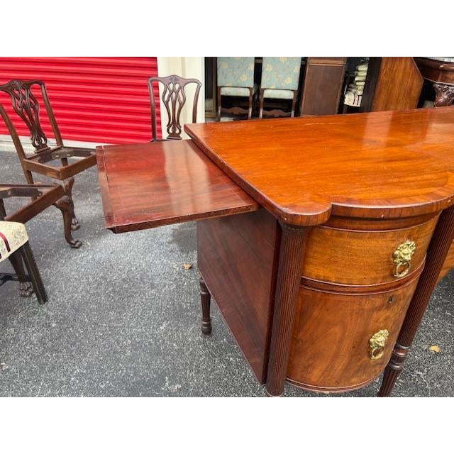 Experience the elegance of the Georgian era with this exquisite large antique sideboard, a testament to the timeless...