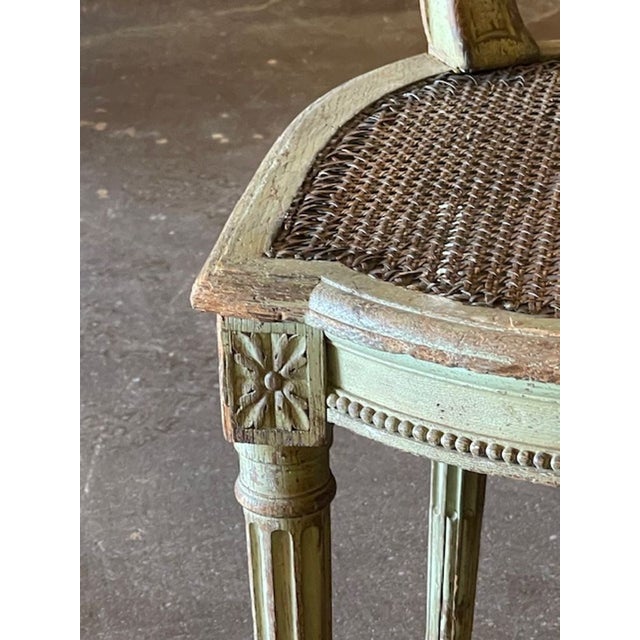 This product is a pair of French Louis XVI side chairs, designed for adult use in a home or garden setting. The elegant...