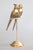 A stylish pair of vintage Mid-Century brass sculptural parrots or lovebirds perched on a stand with a lovely brass patina....