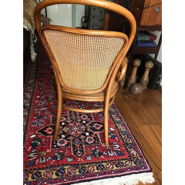Lower armchair by Thonet nr 12 in beech natural. Labeled and stamped by Thonet circa 1890. Measures: 55 x 53 x 98 x 42....