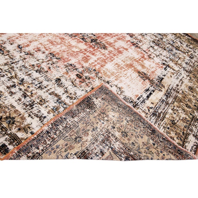 Beautiful hand-knotted vintage Persian Mahal wool rug with a rusted field. This distressed rug has a brown frame and blue...
