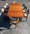 An incredible, classic Danish teak dining set. The table is constructed brilliantly with two recessed butterfly leaves...