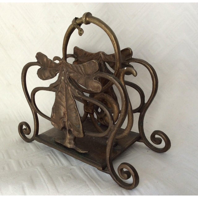 A vintage Italian hand forged metal Letter Holder. The Letter Holder is decorated with a leaf motif and has a metal tag...