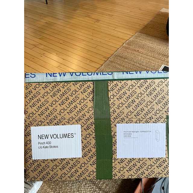 Pair of New Volumes Terracotta Pinch Small Wall Lights designed by Kate Stokes, brand new and never installed — perfect...