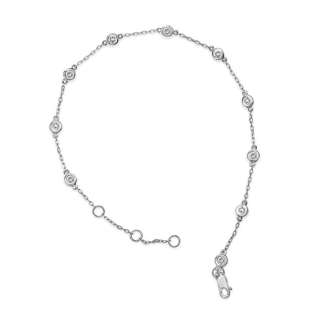 Exuding timeless elegance, this bracelet marries classic design with luminescent beauty. Crafted from radiant 14K white...
