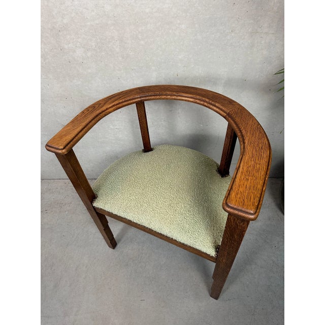 Original semi-circular oak Art Deco chair. Professionally fitted with new spring frames and a pleasant soft green...
