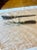 Antique 19th Century Victorian era meat carving fork and sharpening steel with stag horn handles and sterling silver...