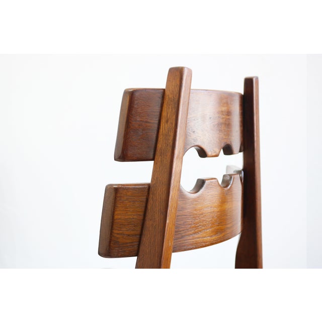 A set of six original brutalist dining chairs designed by Henning Kjærnulf and produced by Nyrup Møbelfabrik in the 1970s....