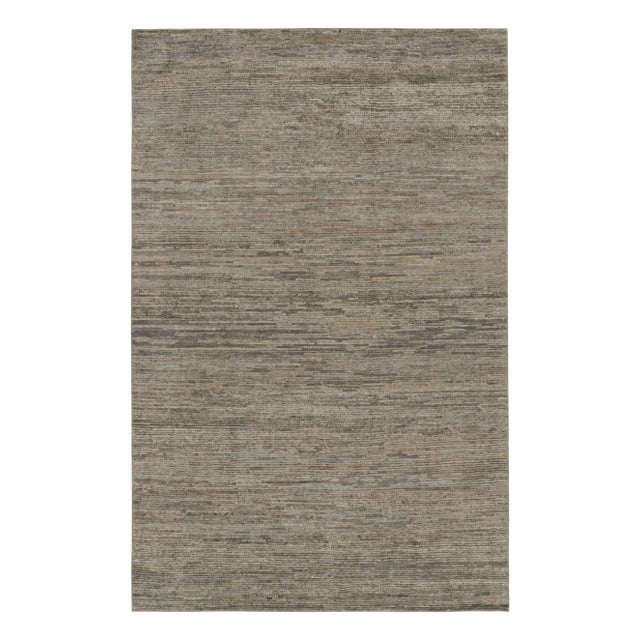 Hand-knotted in wool, silk , this 6x9 contemporary simple rug in gray and beige as an addition to the Rug & Kilim’s...