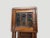 Colonial teak wood cabinet with bevelled glass and original hardware. We have a pair. The price reflects one. Circa 1950....
