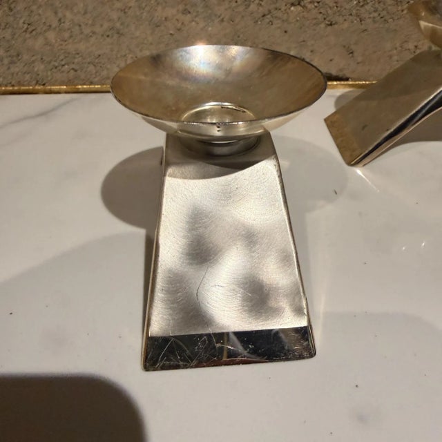 For your consideration, a pair of vintage mid-century WMF Ikora silver-plated candlesticks. Dimensions: 2.63" H x 4.5" W x...