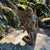 Striking signed and dated 1997 bronze sculpture depicting a kneeling female angel with dramatic outstretched wings. The...