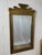 An elegant vintage Chapman wall mirror featuring a sculptural pagoda-form frame crafted in richly patinated brass....