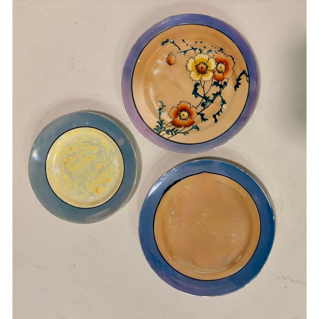 This collection of 12 vintage Japanese lusterware plates are the perfect way to add a little shine to your table...