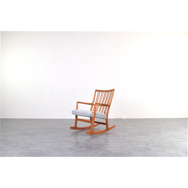 This rocking chair ws designed in the 1950s by Hans J. Wegner for Mikael Laursen. The frame of the armchair is made of...
