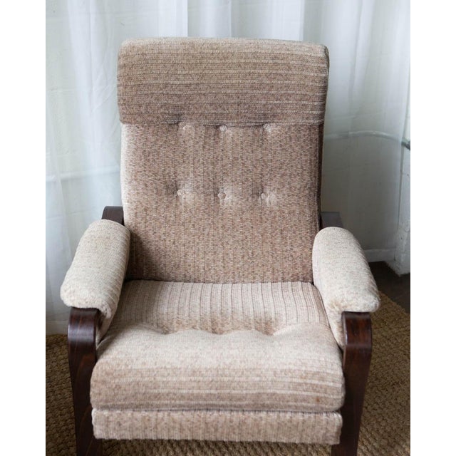 A stylish pair of Danish beech lounge chairs from the 1960s, showcasing classic mid-century Scandinavian design with clean...