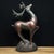 A handsome pair of Chinese solid-copper deer figurines, each posed with graceful outstretched antlers upon a textured...