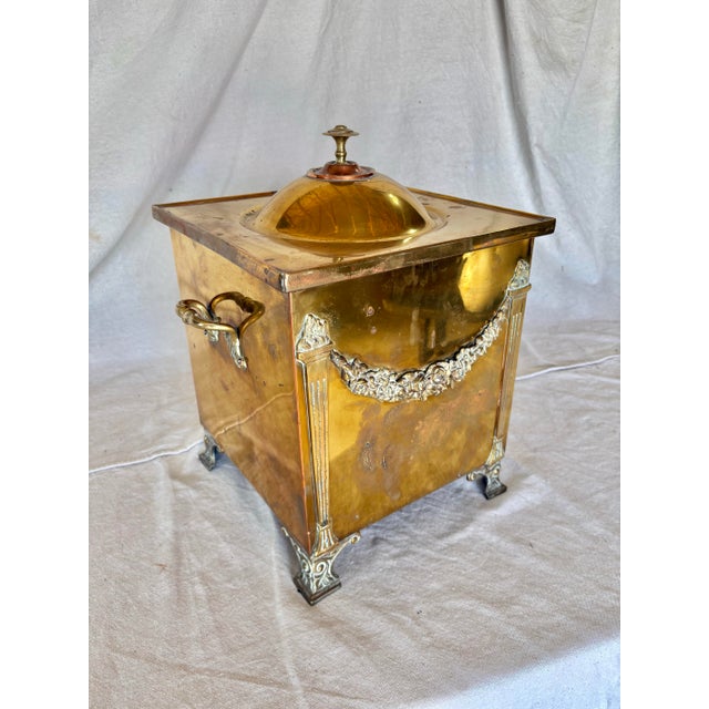 This 20th Century English Brass Fireplace Box dates back to the early 1900's.. Often called a Coal Scuttle, the piece...