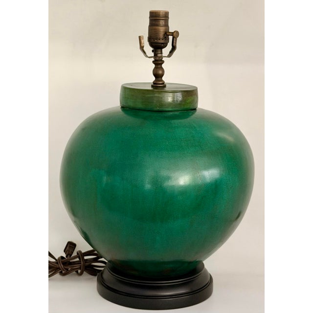 Extraordinary emerald color plump table lamp with silk shade in lovely condition. Large plump