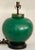 Extraordinary emerald color plump table lamp with silk shade in lovely condition. Large plump