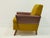 This vintage armchair is from the 1960s and is made from the original materials. The body is made of wood. The seat and...