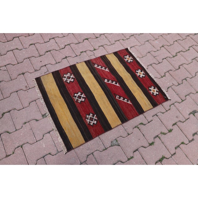1980s Primitive Anatolian Hand Knotted Striped Turkish Kilim Rug Size: 2.2 x 3.1 ft (67 X 95 cm) 26 x 37 inches Color:...