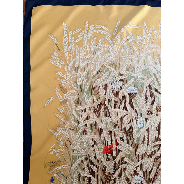 HERMES Les Blés silk scarf from 2006 This delightful scarf depicts golden ears of wheat mingled with wildflowers. Rabbits...