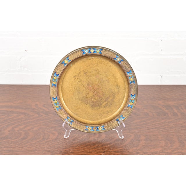 A gorgeous antique Arts & Crafts or Art Deco period gilt bronze charger plate with enameled jewel decoration By Louis...