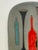 This rare plaque by Bitossi for Raymor has excellent mid century modern style circa 1955. Bottles and vases are depicted...