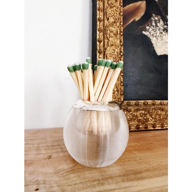 A lovely antique circa 1901 English glass match striker with sterling silver rim. Good antique condition, small signs of...