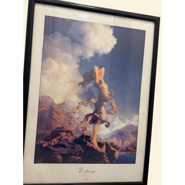The framed art print "Ecstasy" by Maxfield Parrish features a beautiful landscape with a woman depiction set against a...