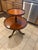 Elegant vintage two-tier dumbwaiter table in the Chippendale tradition, featuring a graduated round serving tiers with...