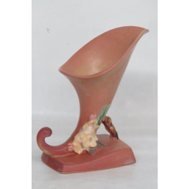 This gorgeous Vase is made out of ceramic, and it is in good condition. This lovely Vase was made by Roseville, a fine...