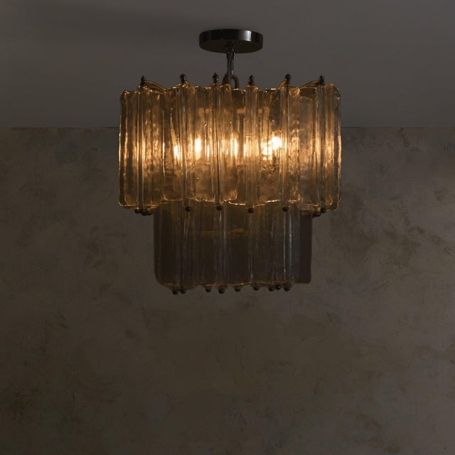 Hand-pulled Murano glass forms the foundation of this 1960s chandelier, attributed to Toni Zuccheri for Venini—each...