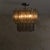 Hand-pulled Murano glass forms the foundation of this 1960s chandelier, attributed to Toni Zuccheri for Venini—each...
