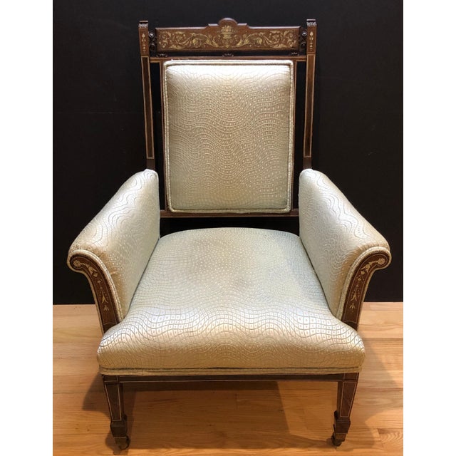 Inlaid marquetry bone and rosewood library chair. Top back stretcher with inlay of fruit filled urn and foliate scrolls...